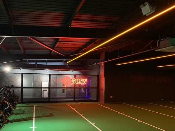 Neon light signage in gym sports hall